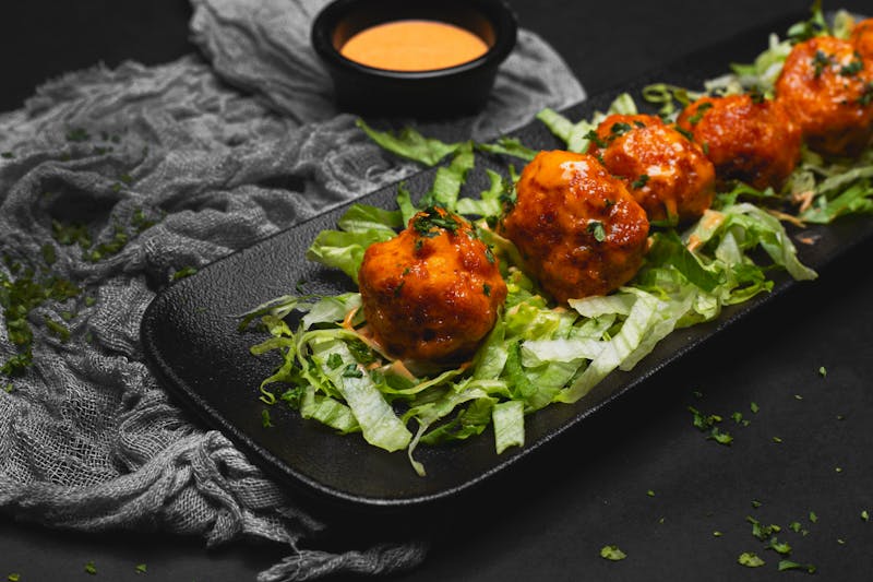Coal-Roasted Meatballs served with marinara sauce at Anthony's coal fired pizza
